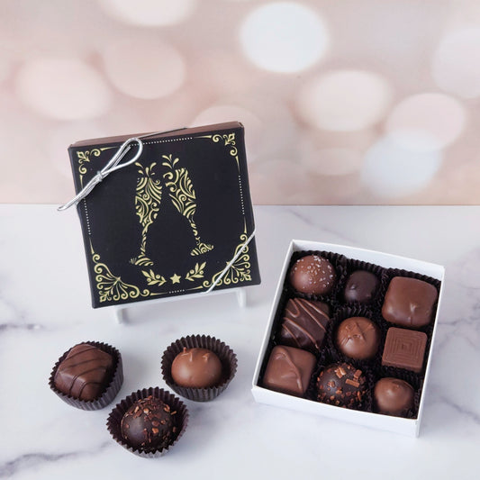 Pop the bubbly and pass the chocolate - our Cheers! Chocolate Box is here to celebrate all of life’s sweet moments. This festive milk and dark chocolate assortment comes in your choice of a 9-piece or 16-piece box, each one topped with a cheerful design featuring clinking champagne glasses. Inside, you’ll discover a joyful mix of smooth creams, buttery caramels, dreamy melt-aways, and rich, decadent truffles. It’s a party in every piece!