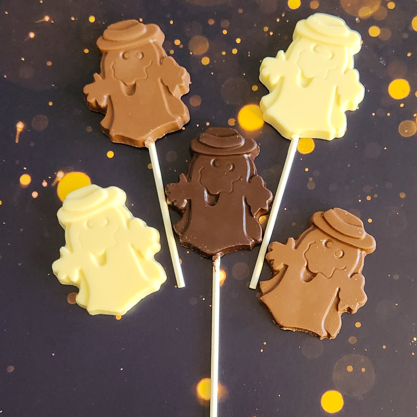 Milk, Dark or White Chocolate Ghost with hat Lollipop or favor.  Measuring approximately 2.75 inches wide by 3.25 inches tall (excluding the pop stick) 