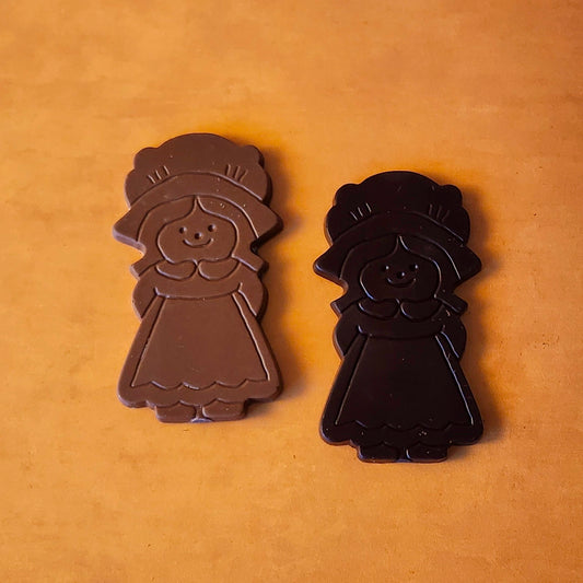 Celebrate Thanksgiving with our charming Girl Pilgrim Chocolate Favor, a delightful addition to any holiday table! Available in smooth milk chocolate or bold dark chocolate, this adorable pilgrim-shaped treat adds a touch of tradition and sweetness to your festivities