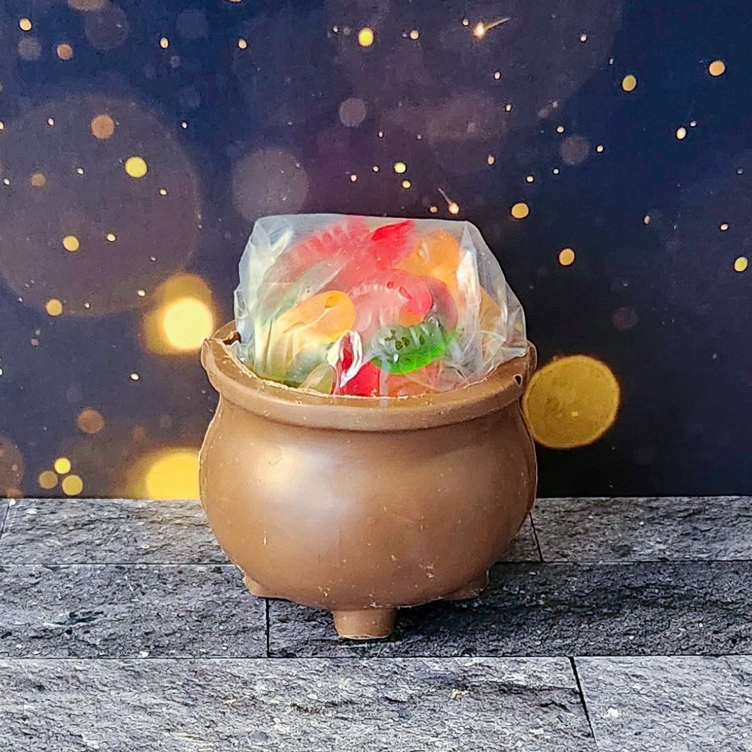 Cast a sweet spell this Halloween with our Milk Chocolate 3D Kettle, crafted from our rich and creamy chocolate. Inside this fun, witchy cauldron, you’ll find a mix of Salt Water Taffy and Gummy Worms. 
Due to its fragile nature, this spooky treat is only available for in-store pick-up.