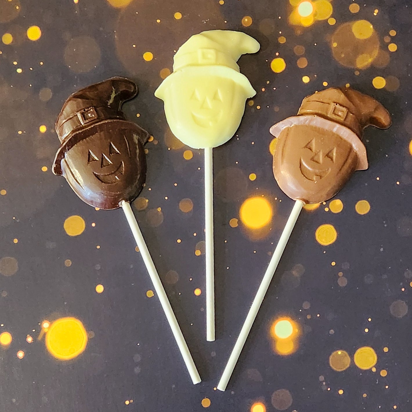 Milk, Dark and White Chocolate Pumpkin wearing witch hat lollipops 