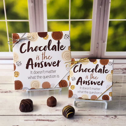 An assortment of our most popular milk and dark chocolate creams, caramels, melt-aways, and truffles all packed inside a fun printed box. The cover of the box says "Chocolate is the Answer. It doesn't matter what the question is."