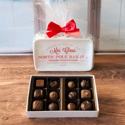 These holiday-themed trays are paired with a 12-piece assortment of our popular milk and dark chocolates, featuring delicious truffles, creams, caramels, and meltaways. Perfect as a thoughtful gift or festive centerpiece, each tray is beautifully wrapped with a bow for that extra holiday touch.