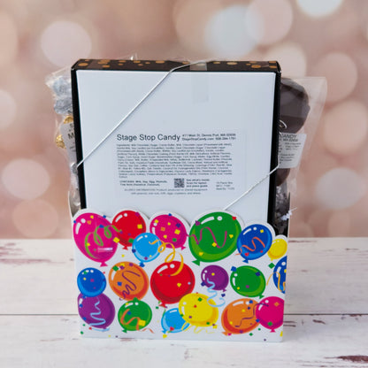 Make life’s big moments even sweeter with our Celebrate Gift Basket!
Inside, you’ll find a mix of gold and silver foiled milk chocolate stars, two chocolate-covered Oreo cookies, and classic milk chocolate nonpareils. A milk chocolate card that says “Congratulations”, dark chocolate-covered cranberries and a luxurious 16-piece assortment of creams, caramels, meltaways, and truffles. All overwrapped with a bow and ready for gifting!