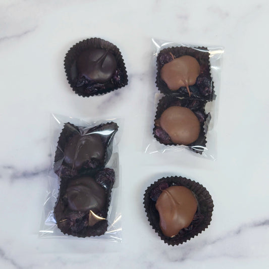 Milk or dark chocolate Cranberry Caramel Nut Clusters.  2 count package