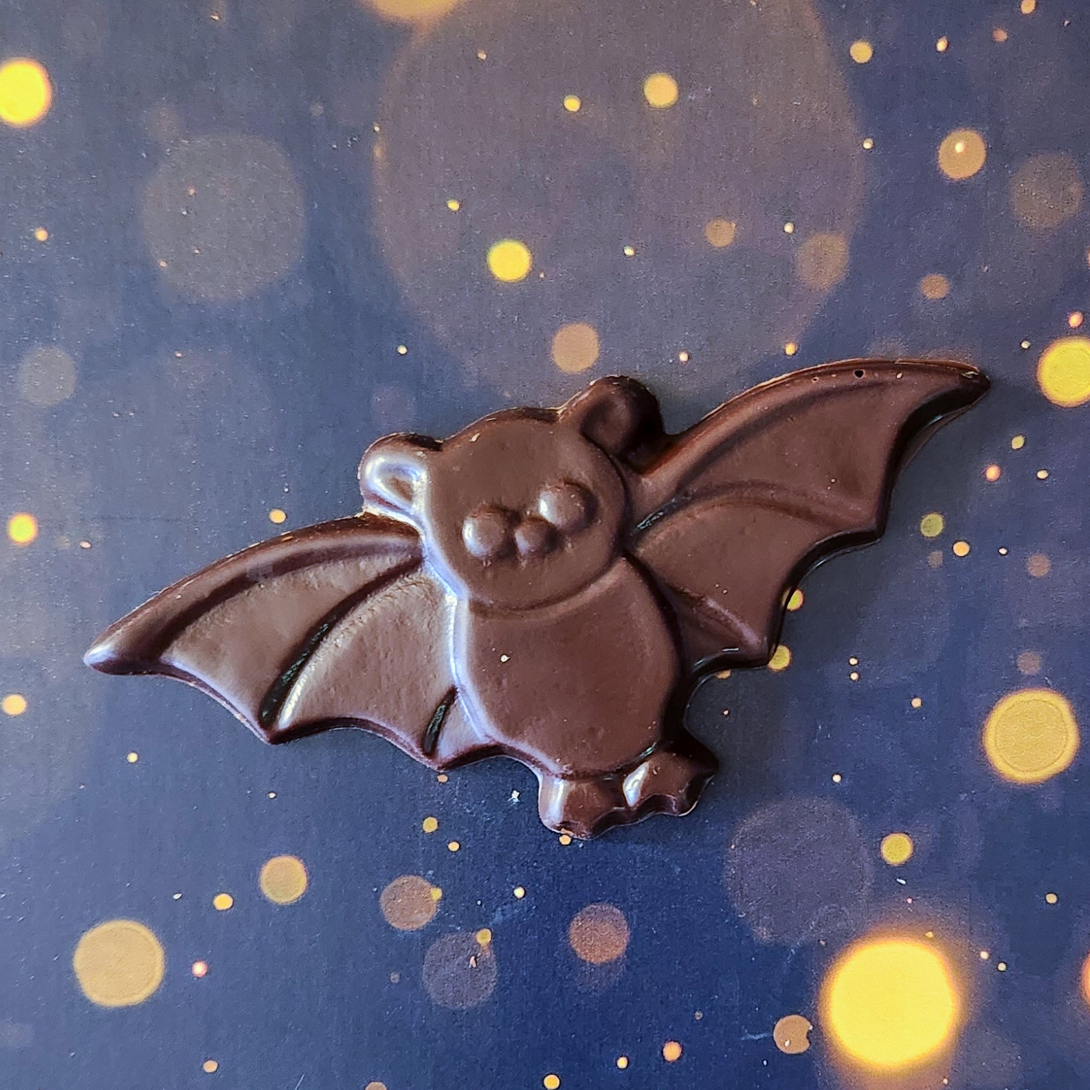 Dark Chocolate Bat Favor. Measuring approximately 4.75 inches wide by 2.25 inches tall and weighing around 28 grams, these chocolate bats are just the right size for a sweet snack