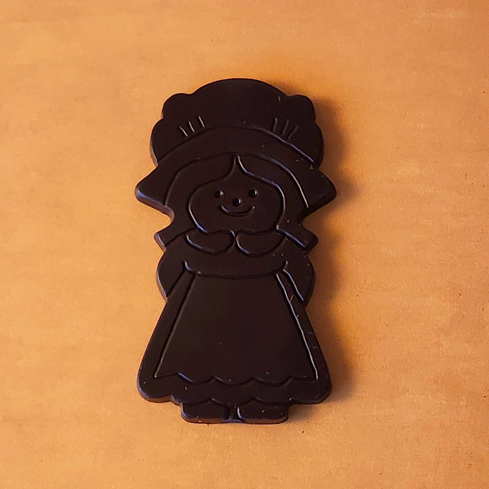 Celebrate Thanksgiving with our charming Girl Pilgrim Chocolate Favor, a delightful addition to any holiday table! Available in smooth milk chocolate or bold dark chocolate, this adorable pilgrim-shaped treat adds a touch of tradition and sweetness to your festivities