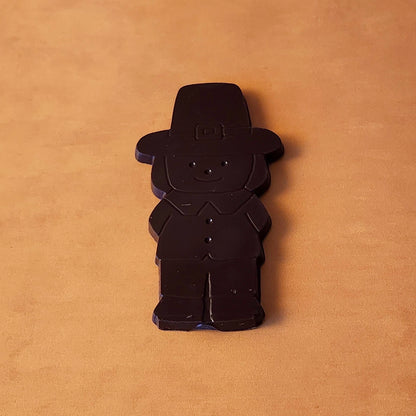 Add a touch of holiday tradition to your Thanksgiving celebrations with our Boy Pilgrim Chocolate Favor. Available in smooth milk chocolate or rich dark chocolate, this adorable pilgrim-shaped treat is perfect as a table favor, a small gift, or a delicious addition to your dessert table