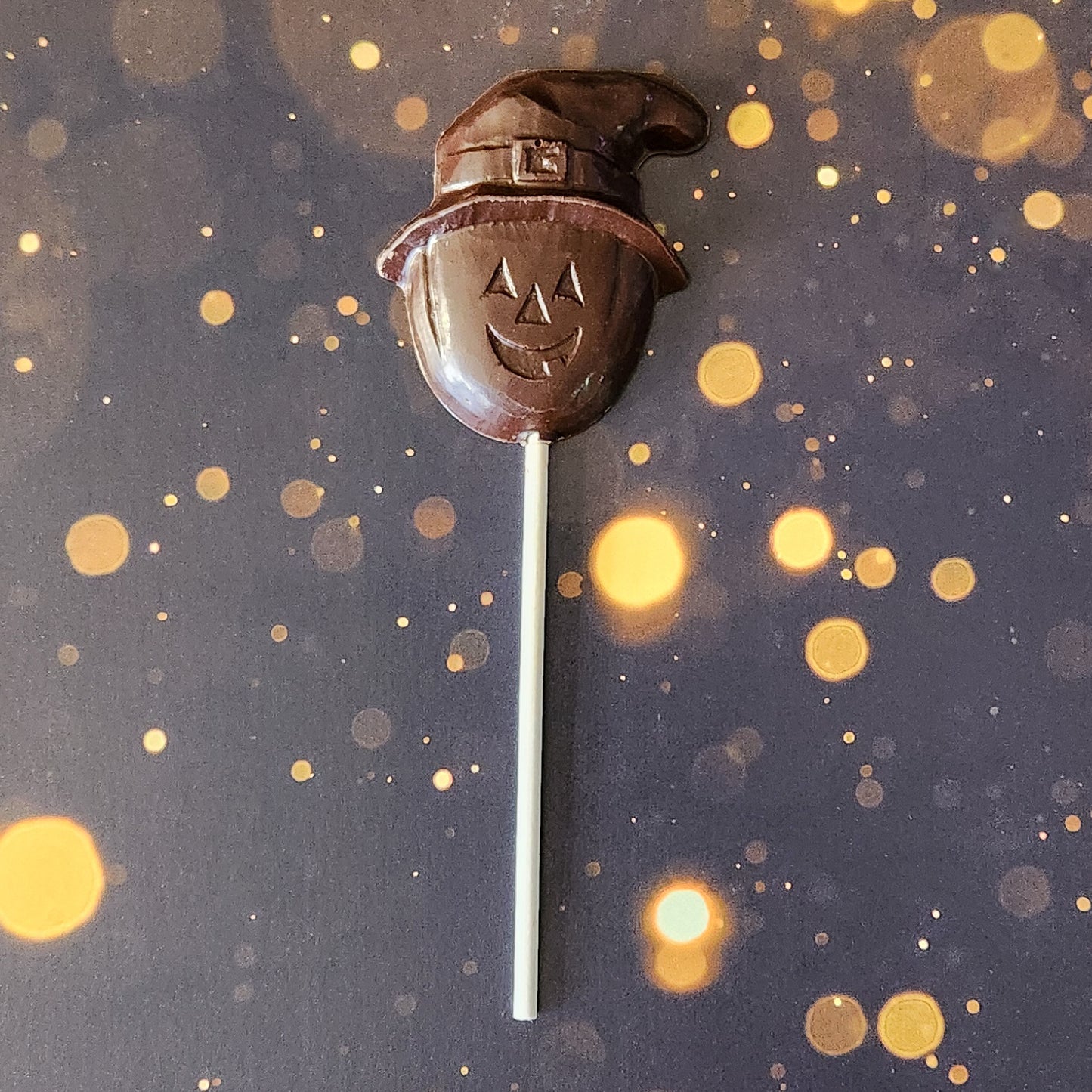 Dark Chocolate Pumpkin with witch hat lollipop