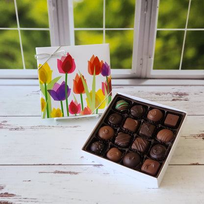 16 pieces of hand crafted creams, caramels, meltaways and truffles. An assortment of both milk chocolate and dark chocolate. Perfect for spring with a tulip floral pattern on the cover. 
