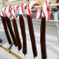 Indulge in a holiday tradition with Stage Stop Candy's Chocolate Dipped Peppermint Candy Canes, made in-house in our candy kitchen in Dennisport on Cape Cod