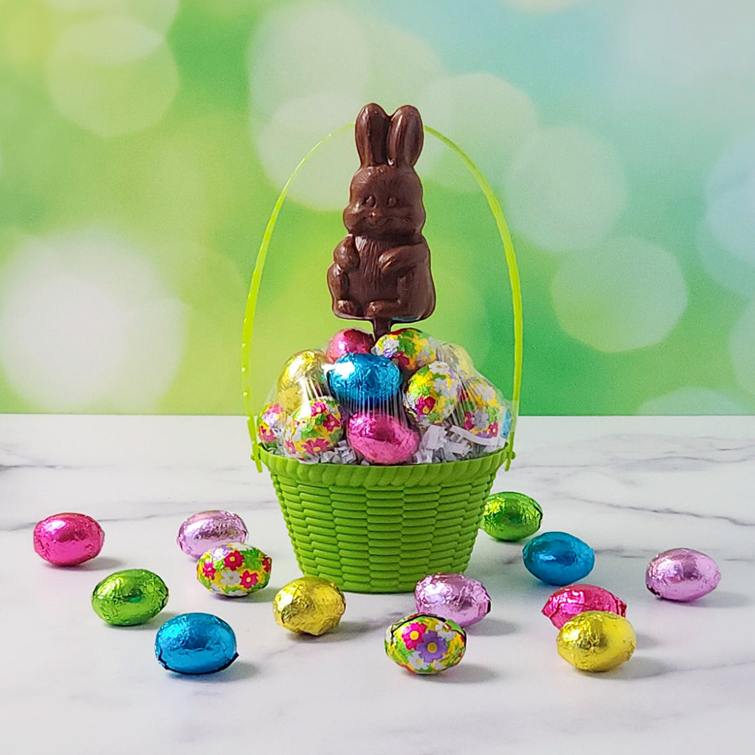 Basket With Foiled Chocolate Eggs And Pop