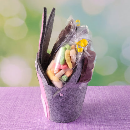 This adorable felt bunny-shaped basket is filled with a delicious assortment of Chocolate-Dipped Marshmallow Peeps, fruity Jelly Beans, Sanded Gummi Bunnies, and a Chocolate Bunny Favor. Wrapped in overwrap and finished with a beautiful bow