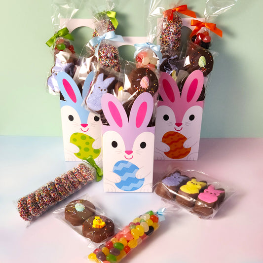 Bunny Door Hanger Gift Basket.
Inside you will find Jelly Beans, Milk Chocolate Nonpareils, Milk Chocolate Oreos dressed up with an Easter sugar decoration, and Chocolate Covered Peeps!
The box is designed to hang on a door knob.