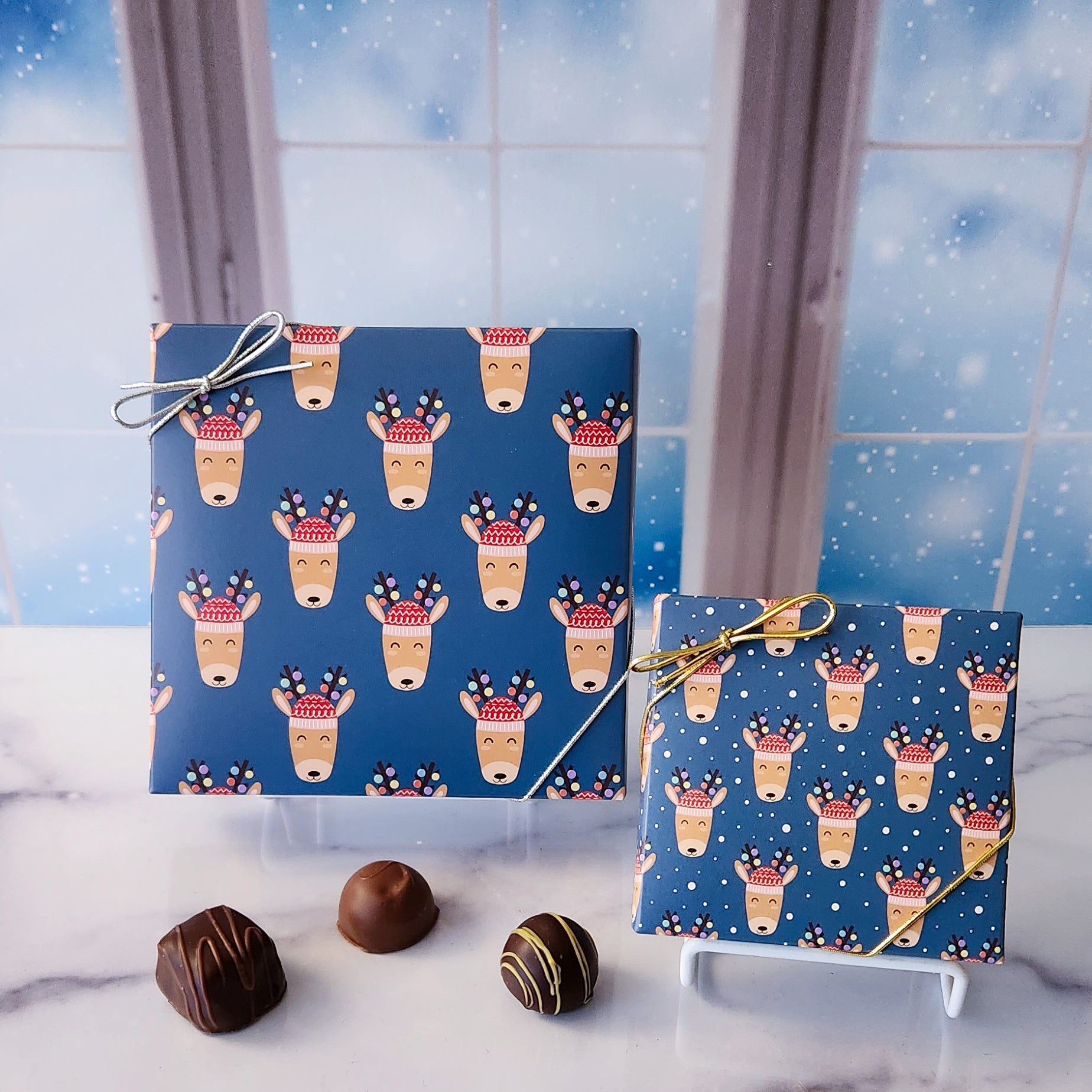 An assortment of our most popular milk and dark chocolate creams, caramels, melt-aways, and truffles all packed inside a box with a festive reindeers printed on the cover.