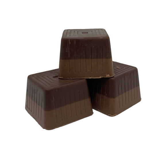 Indulge in the delightful taste of Figaro; a combination of rich milk and dark chocolate infused with hazelnut flavor and 12 pieces per box.