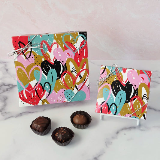 Indulge in a chocolate adventure with our Fluttering Heart Box! - a delightful assortment of creams, caramels, melt‑aways, and truffles in milk and dark chocolate.
Available in a 9 piece or 16 piece box