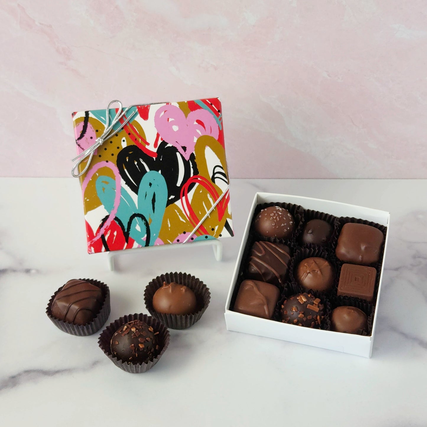Indulge in a chocolate adventure with our Fluttering Heart Box! - a delightful assortment of creams, caramels, melt‑aways, and truffles in milk and dark chocolate.
9 Piece box