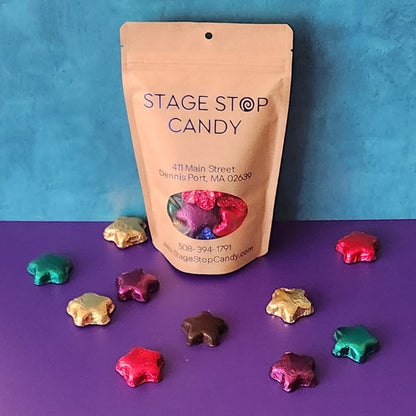 Decedent Dark Chocolate stars are covered in brightly color foil. 