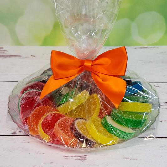 Enhance your celebration with our 30 Piece Fruit Slice Party Tray, featuring a colorful assortment of juicy, fruit-flavored slices, beautifully overwrapped and tied with a festive bow. Perfect for any occasion, this ready-to-serve tray offers a delightful mix of tangy citrus and sweet berry flavors, guaranteed to impress and satisfy your guests.