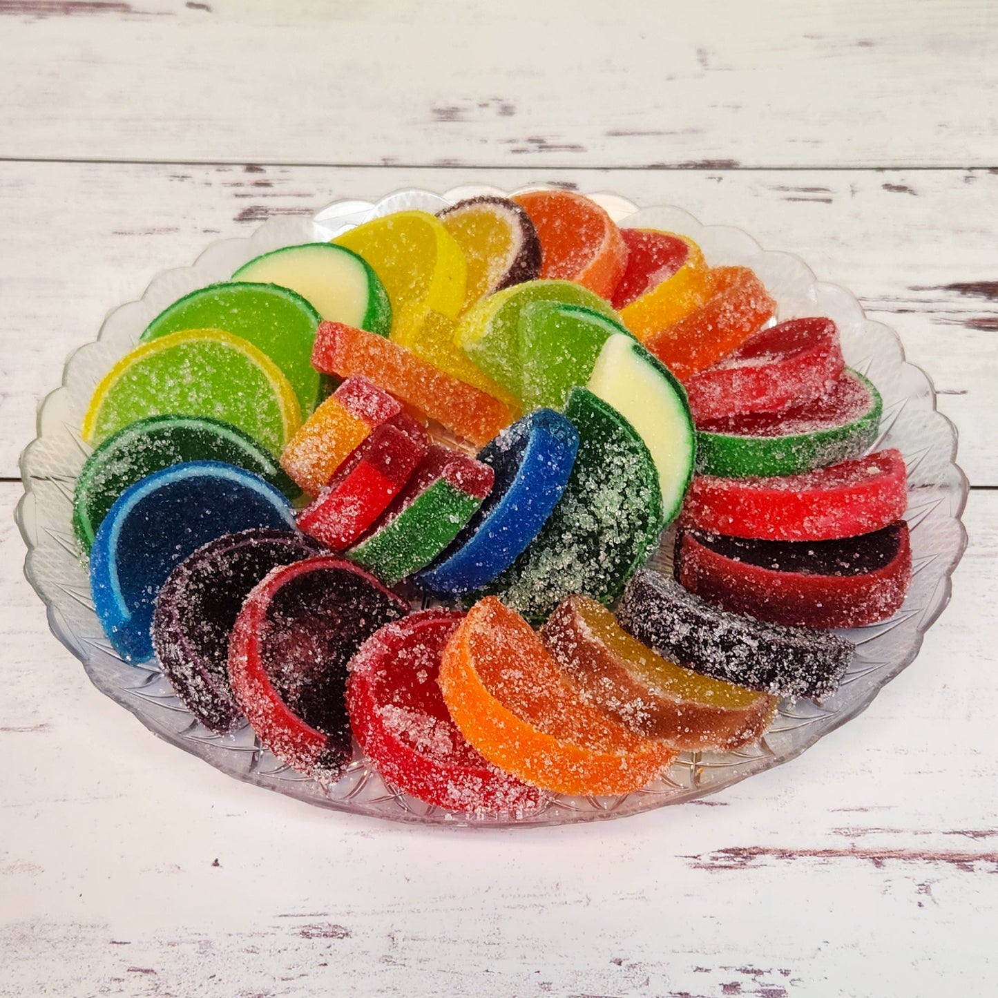 Transform your gathering with our 30 Piece Fruit Slice Party Tray, showcasing a vibrant selection of fruit-flavored slices, elegantly wrapped and adorned with a festive bow. Ideal for any event, this ready-to-serve tray features a delicious mix of tangy citrus and sweet berry flavors, ensuring a delightful and impressive treat for your guests.