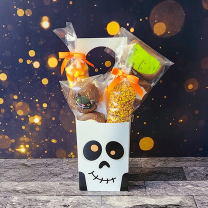 Skeleton Skull Halloween Door Hanger.  Inside, you'll find chocolate-covered Oreos, classic candy corn, delicious milk chocolate nonpareils, and chocolate-dipped Halloween Peeps!