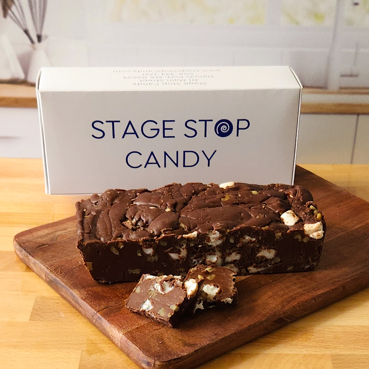 Enjoy our fresh, onsite-made Rocky Road Fudge, featuring a rich chocolate fudge base mixed with fluffy marshmallows and delicious walnuts. Each  piece is crafted with high-quality ingredients for a delightful and indulgent treat.