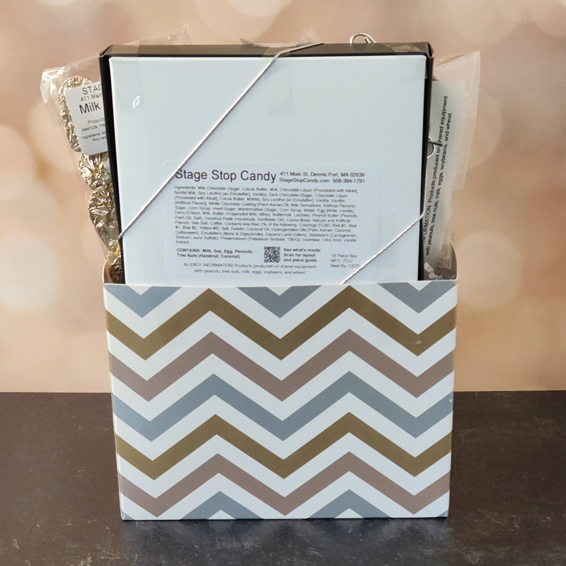 Happy Anniversary Gift Basket.
foiled milk chocolate hearts, dark chocolate–covered cranberries, milk chocolate‑covered Oreos and milk chocolate nonpareils. Topped with a whimsical milk chocolate card that reads “Happy Anniversary,” it’s a heartfelt way to express your love. The centerpiece is a 16‑piece gift box filled with an assortment of creams, caramels, meltaways, and truffles. 