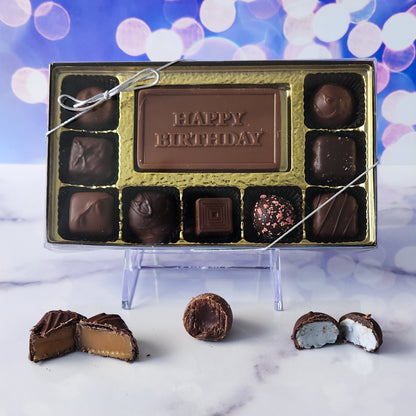 Celebrate their special day with our 9-piece Happy Birthday Candy Box! Inside, a beautifully crafted milk chocolate card that says "Happy Birthday" is surrounded by an array of smooth milk and dark chocolate soft center creams, rich truffles, and delightful caramels. It's the perfect way to make their birthday extra sweet and memorable!