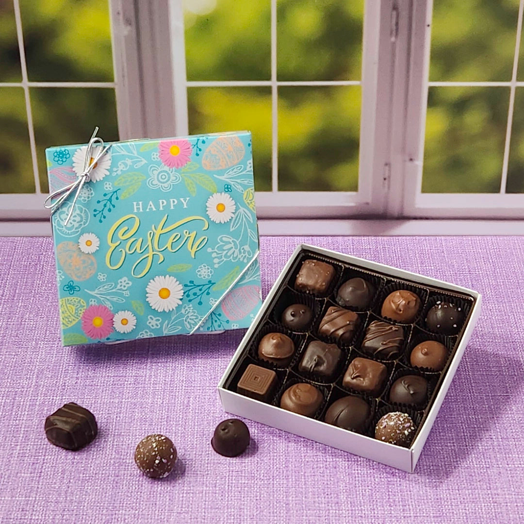 Box of chocolates and Easter box on a purple surface with a window in the background