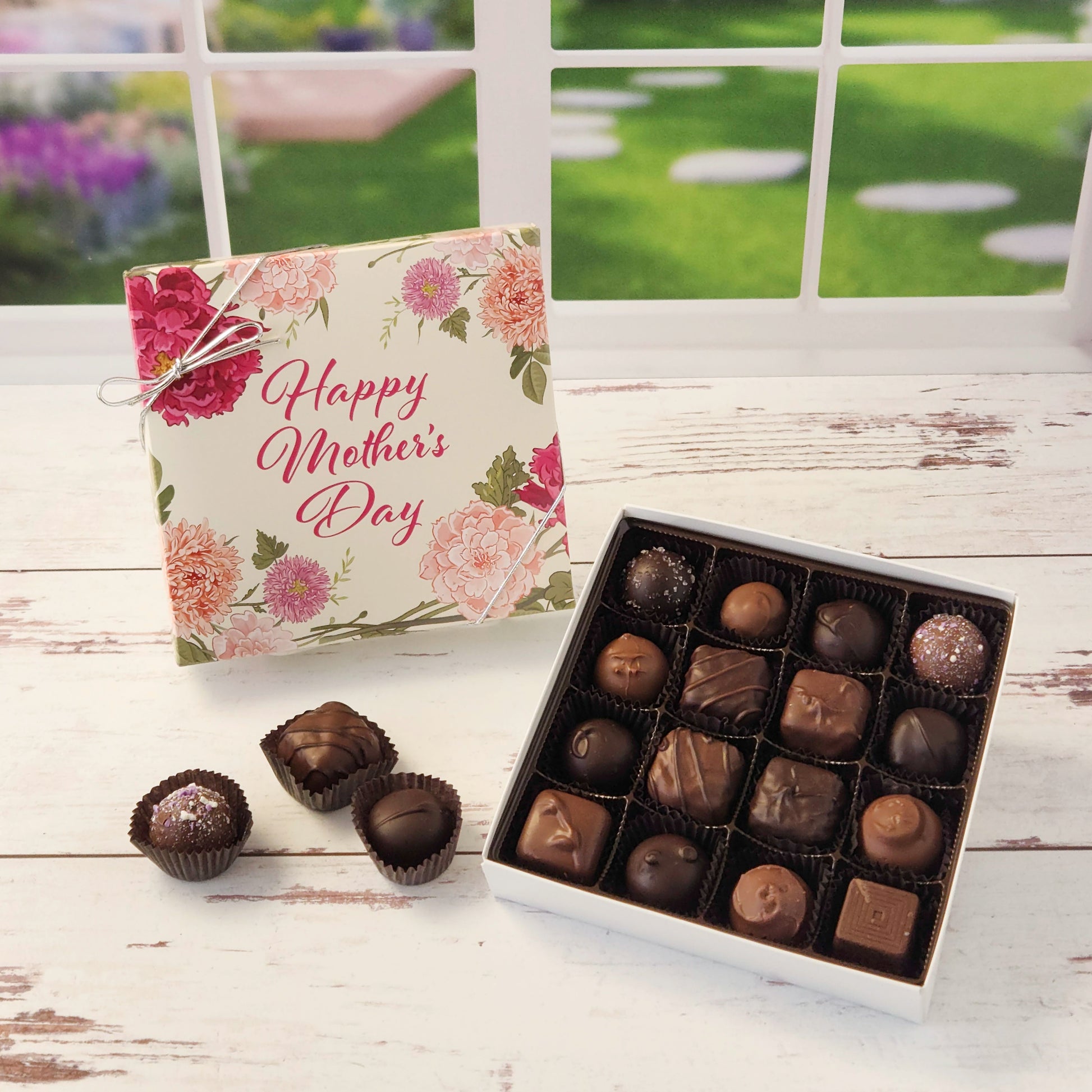 Celebrate Mom with this 16 piece assortment of milk and dark chocolate creams, caramels, melt‑aways and truffles inside a decorative Happy Mother's Day box perfect for gifting.
