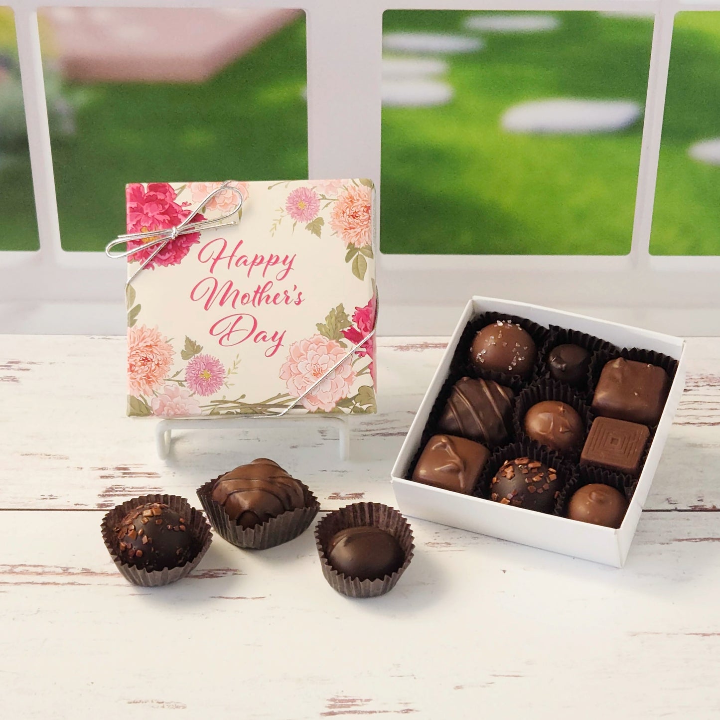 Celebrate Mom with this 9 piece assortment of milk and dark chocolate creams, caramels, melt‑aways and truffles inside a decorative Happy Mother's Day box perfect for gifting.