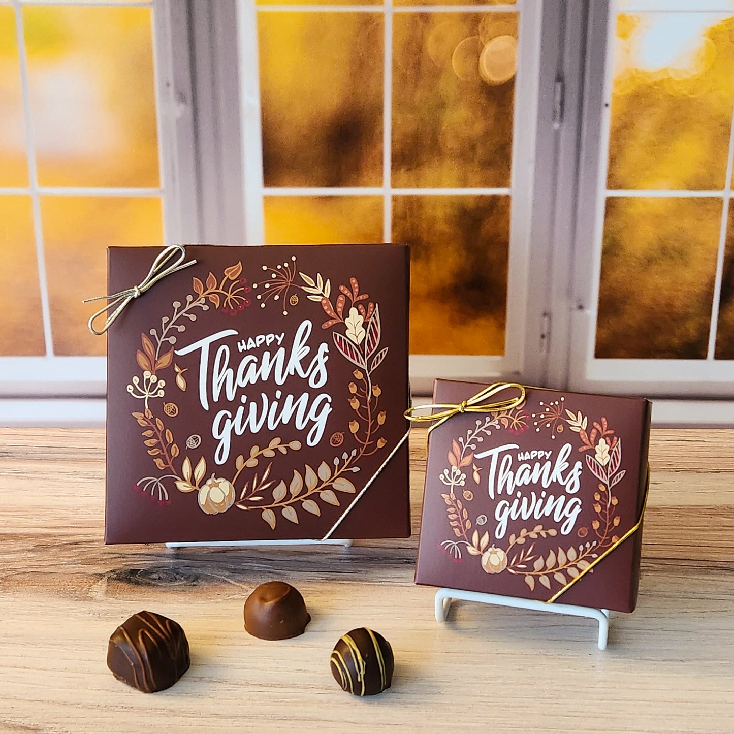 An assortment of our most popular milk and dark chocolate creams, caramels, melt-aways, and truffles all packed inside a box with the words "Happy Thanksgiving" printed on the cover.