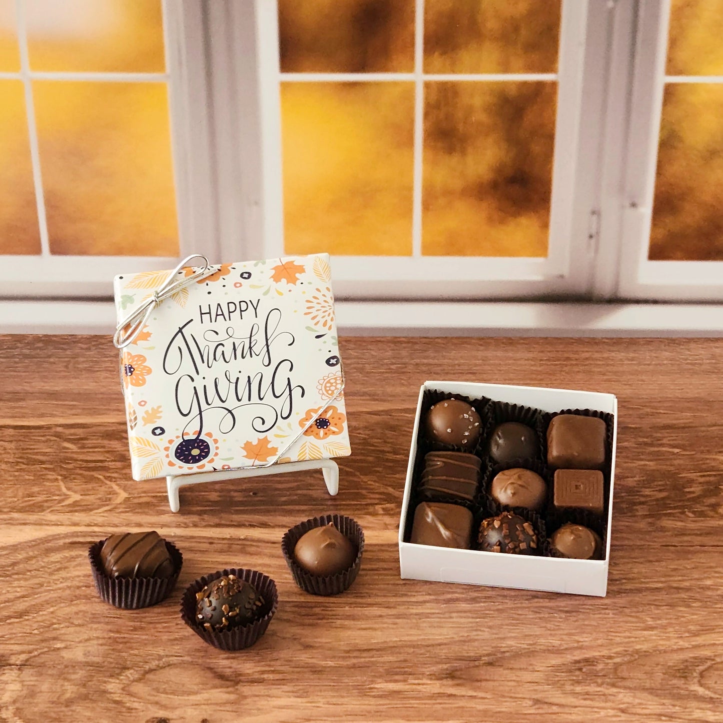 This Happy Thanksgiving Assortment Box is a collection of our popular handmade chocolates. Available in 9-piece or 16-piece boxes, this assortment features a mix of milk and dark chocolate truffles, creams, caramels, and meltaways.