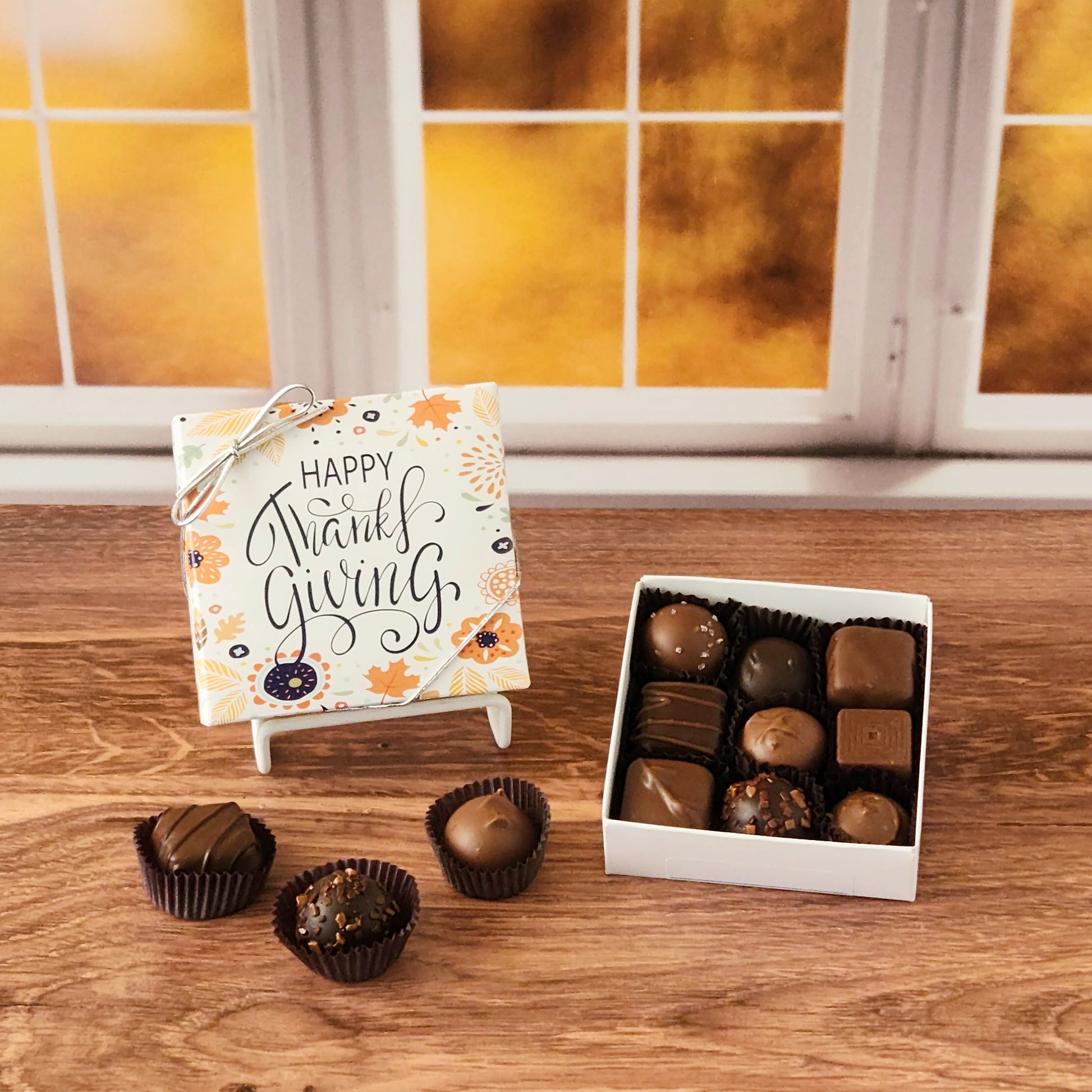 This Happy Thanksgiving Assortment Box is a collection of our popular handmade chocolates. Available in 9-piece or 16-piece boxes, this assortment features a mix of milk and dark chocolate truffles, creams, caramels, and meltaways.