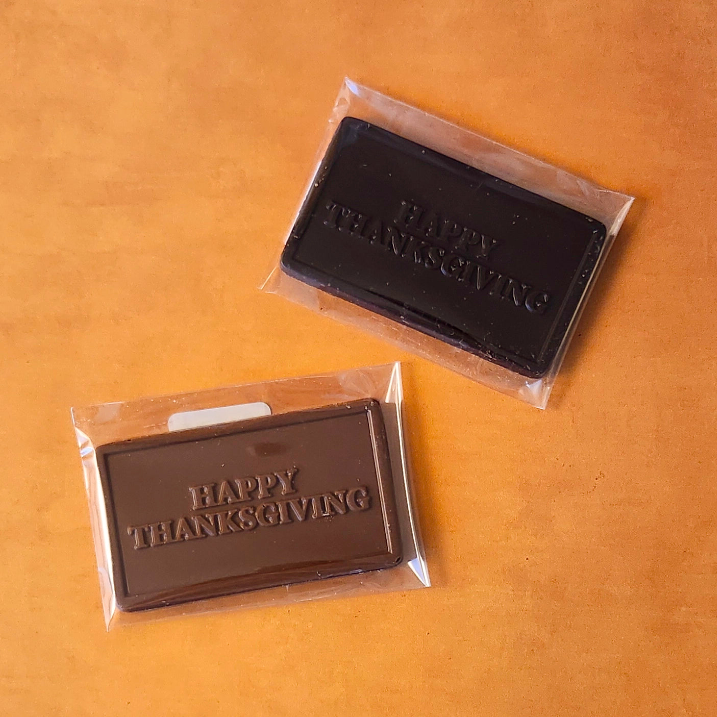 Say “Happy Thanksgiving” in the sweetest way with our Happy Thanksgiving Small Chocolate Card! Available in smooth milk chocolate or rich dark chocolate, each card features a festive greeting embossed right on the chocolate, making it a delightful treat for the holiday.