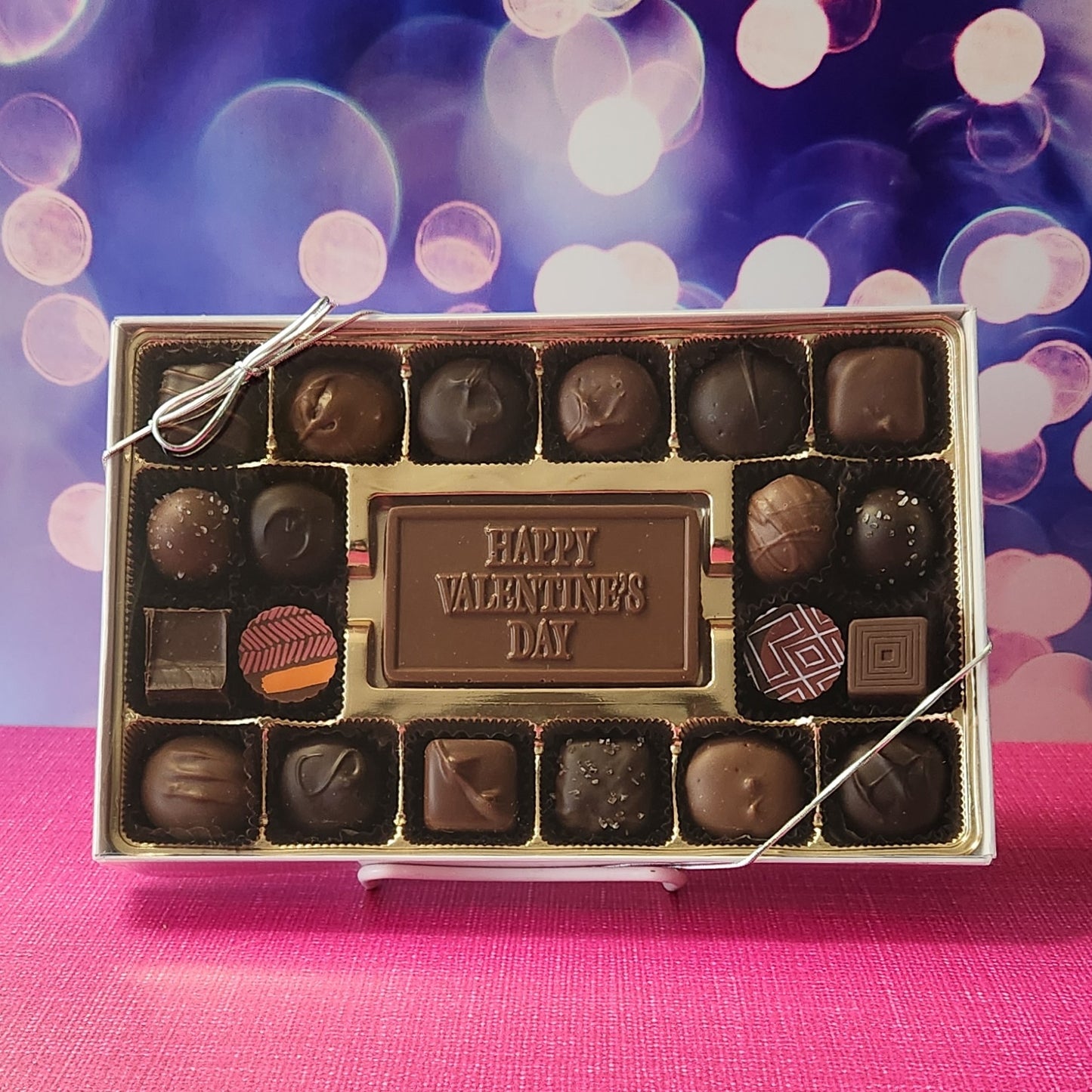 This 20 piece milk and dark chocolate candy assortment has all your favorites. From Soft Centers to Truffles there is something for everyone. Right in the center is a Milk Chocolate card that wishes you a Happy Valentine's Day. 