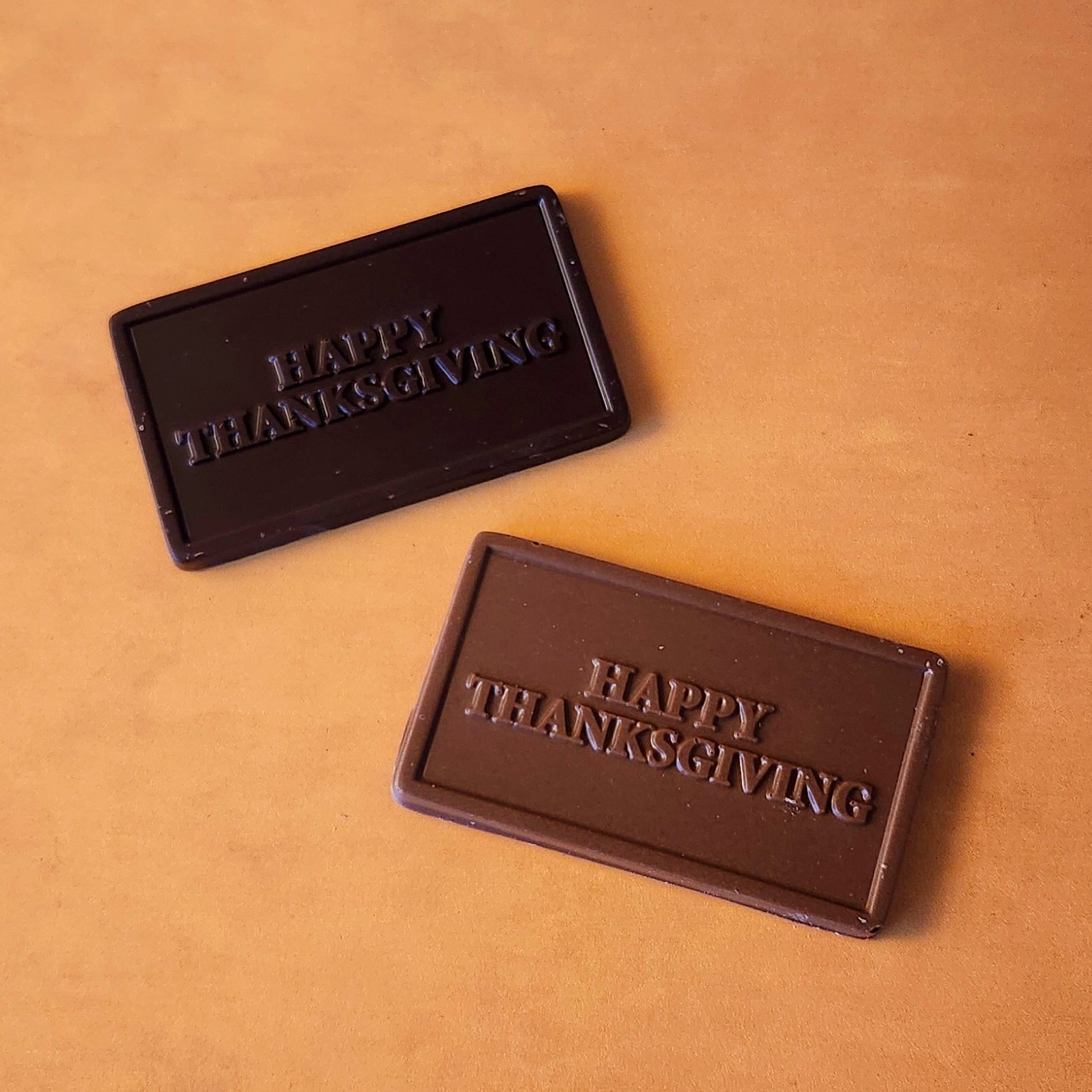 Say “Happy Thanksgiving” in the sweetest way with our Happy Thanksgiving Small Chocolate Card! Available in smooth milk chocolate or rich dark chocolate, each card features a festive greeting embossed right on the chocolate, making it a delightful treat for the holiday.