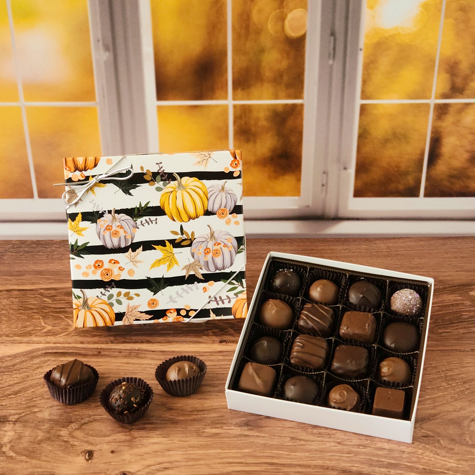 Celebrate the sweetness of the season with our Harvest Gathering Chocolate Assortment!  Available in a 9-piece or 16-piece box, this collection is filled with rich milk and dark chocolates, crafted in small batches right here in our candy kitchen.  Each bite is a surprise of flavor and texture, featuring silky creams, gooey caramels, melt-in-your-mouth meltaways, and decadent truffles that capture everything we love about fall.