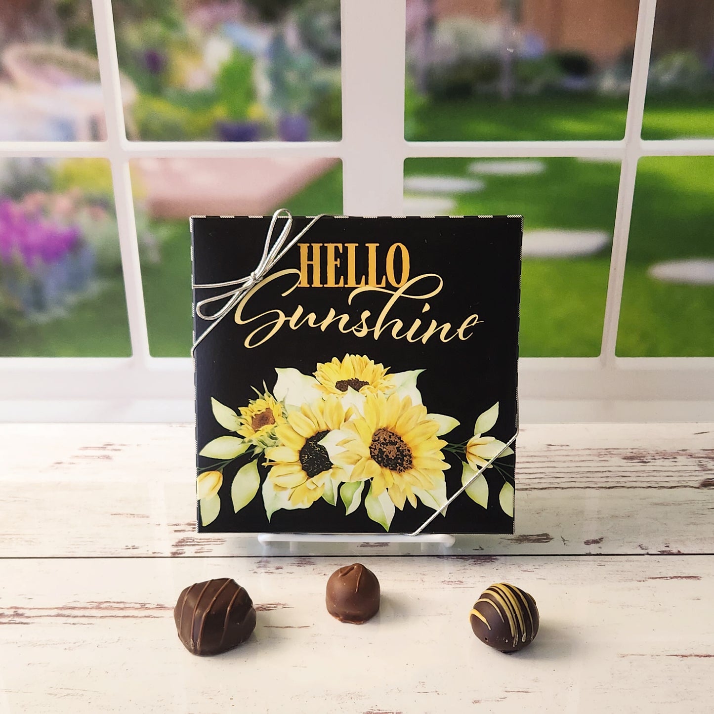 An assortment of our most popular milk and dark chocolate creams, caramels, melt-aways, and truffles all packed inside a Hello Sunshine with Sunflowers printed box.