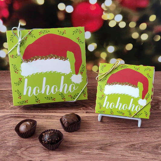 Chocolate assortment box with ho ho ho Santa hat Christmas themed box.  Filled with a variety of creams, caramels, melt-aways and  truffles.
Available in 9 or 16 pieces.