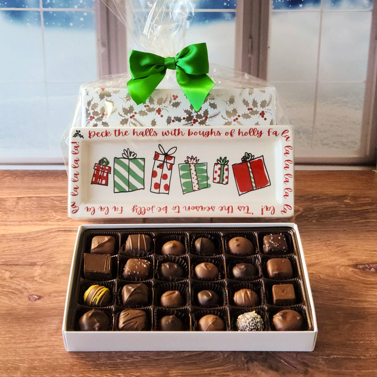 Celebrate the holiday season with our Holiday Sayings Candy Tray! Each tray features a unique holiday saying paired with a 24-piece assortment of our most popular milk and dark chocolates, including truffles, creams, meltaways, and caramels. Beautifully wrapped and bursting with flavor, this tray makes a thoughtful gift or the perfect addition to your holiday celebrations