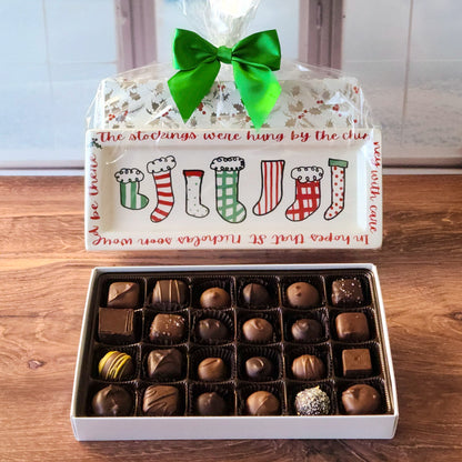 Celebrate the holiday season with our Holiday Sayings Candy Tray! Each tray features a unique holiday saying paired with a 24-piece assortment of our most popular milk and dark chocolates, including truffles, creams, meltaways, and caramels. Beautifully wrapped and bursting with flavor, this tray makes a thoughtful gift or the perfect addition to your holiday celebrations