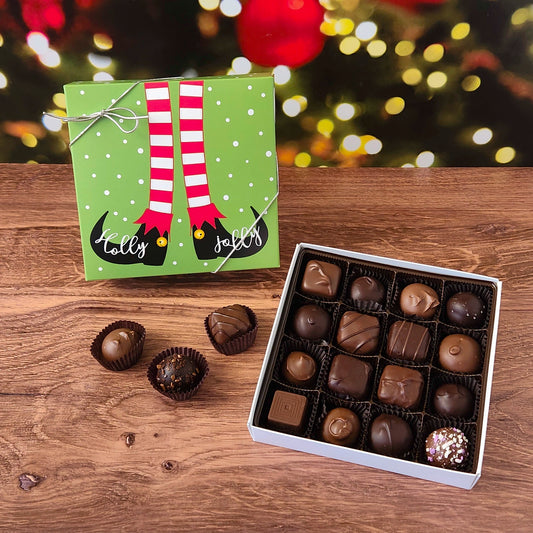 16 piece chocolate assortment box with holly jolly elf Christmas themed box.  Filled with a variety of creams, caramels, melt-aways and  truffles.