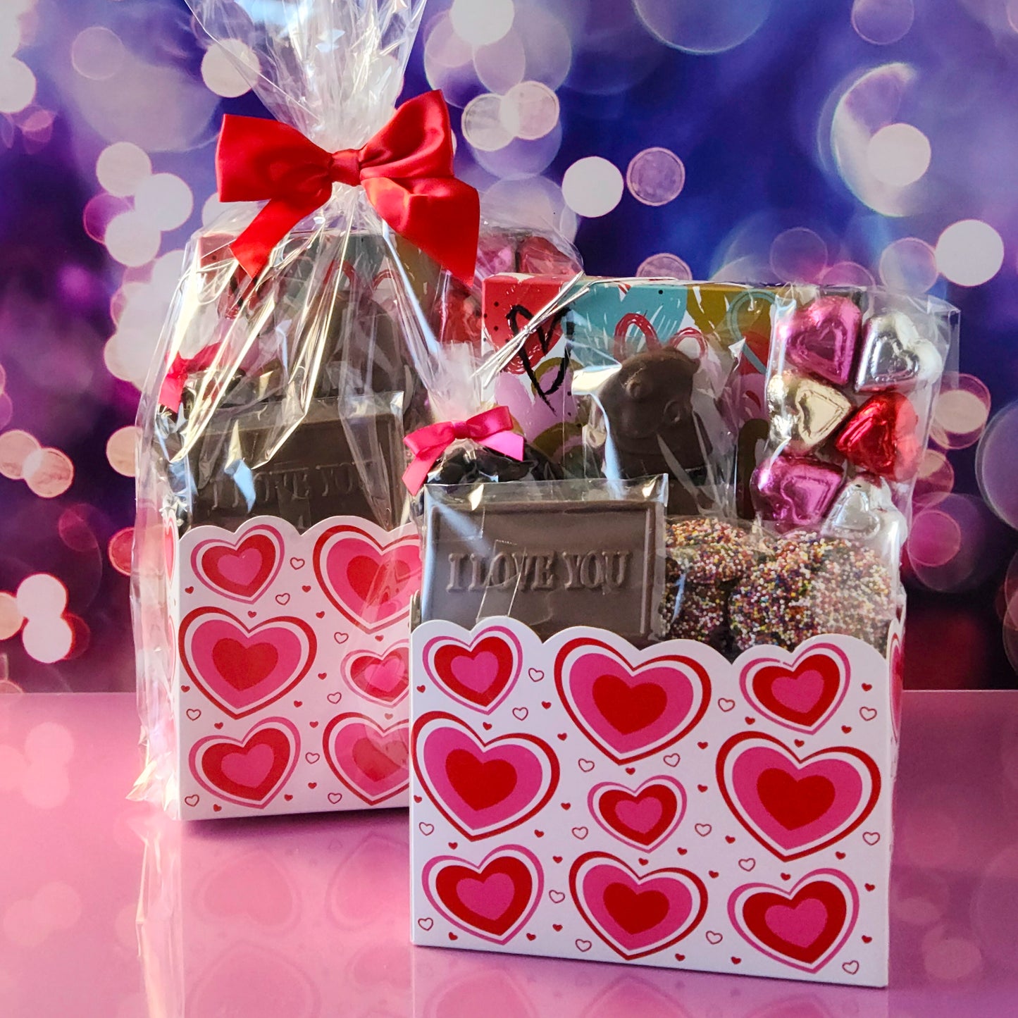 Make this Valentine’s Day unforgettable with our Valentine’s Day Gift Basket featuring:
Dark Chocolate Covered Cranberries, Milk Chocolate Oreos ,  Milk Chocolate Nonpareils, Milk Chocolate Foil Hearts, A 16-piece Assortment and a charming Milk Chocolate Card that says I Love You, the sweetest way to express your feelings.