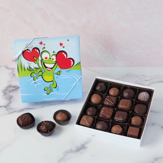 Hop into a world of chocolatey bliss with our Leaping Frog Chocolate Assortment! Bursting with rich milk and dark chocolate favorites, this festive 9-piece or 16-piece box is perfect for anyone who loves a little whimsy with their sweets.
Inside, you'll discover a delicious variety of handmade favorites: silky meltaways, buttery caramels, rich truffles, and smooth, dreamy creams.