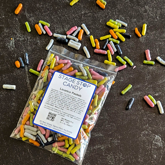 Packaged licorice pastels with a label on a dark surface