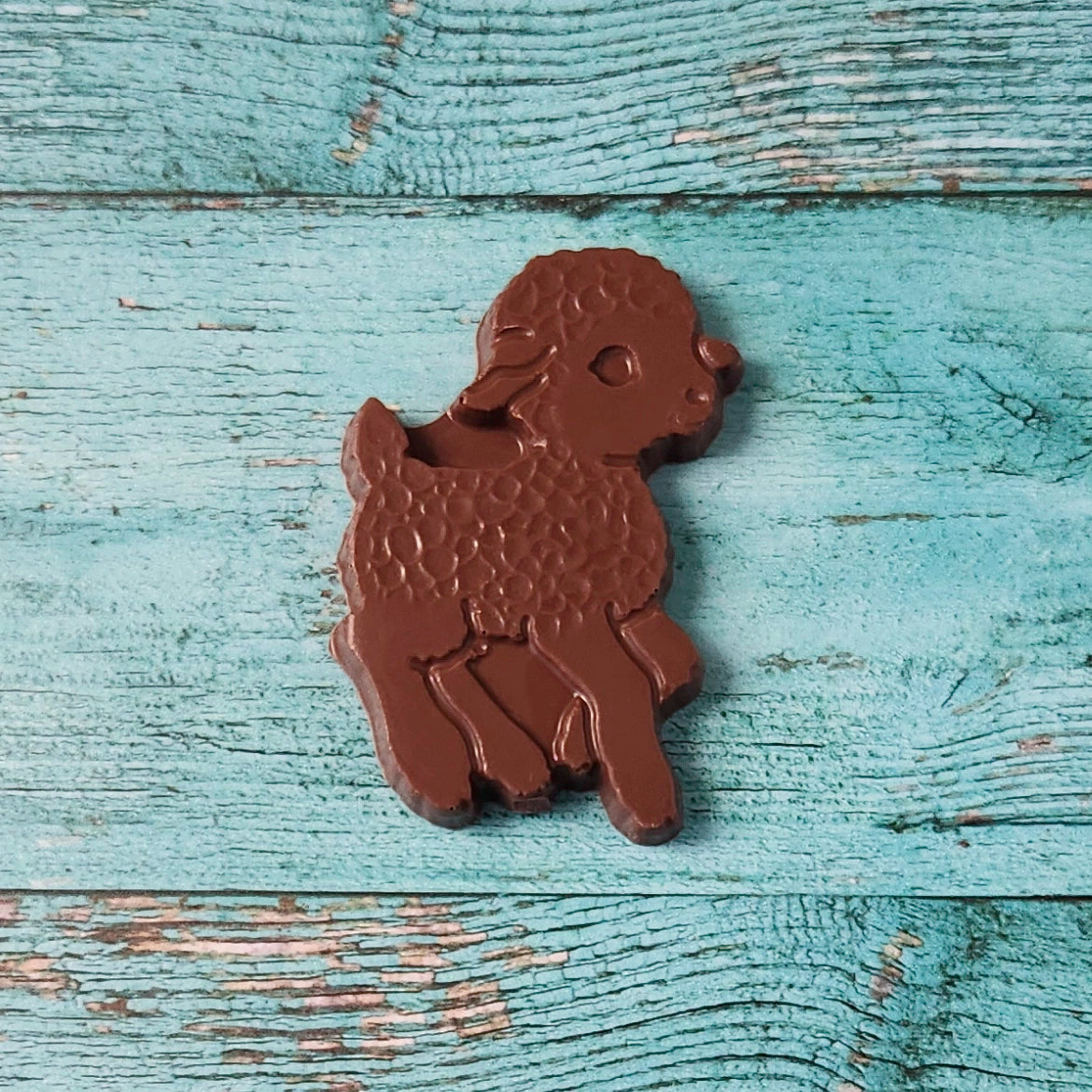 Chocolate lamb-shape on a wooden surface