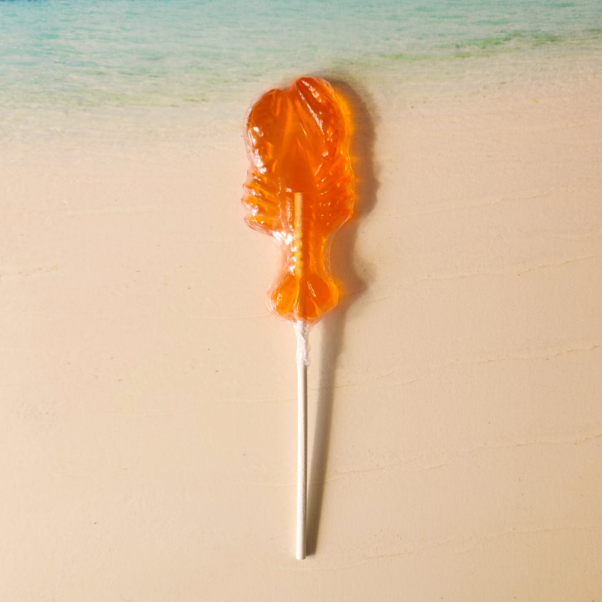 bright citrus orange flavor gives this lobster hard candy pop some zing!