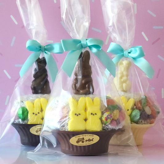 Our Medium Chocolate Basket is made of Milk, Dark or White chocolate. We then fill it with fruit flavored jelly beans, soft marshmallow Peeps, chocolate foiled eggs, speckled malt eggs, and a chocolate covered Oreo. To finish the look a chocolate Easter Bunny pop stands on top.
***Due to its fragile nature this item is only available for in-store pick-up. It can not be shipped***